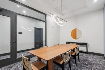 A conference room with a long table and chairs at LiveWell Apartments, Pennsylvania, 15222